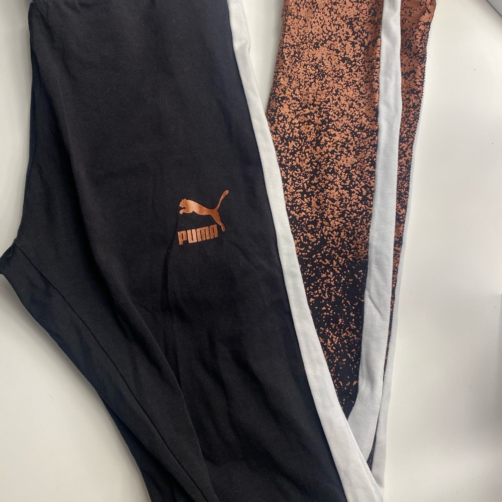 Black and rose gold puma leggings in a size M